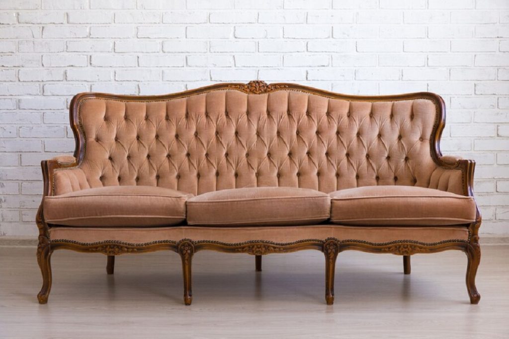 brown-retro-sofa-white-brick-wall_358320-553
