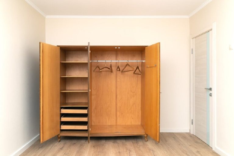 opened-old-wooden-wardrobe-renovated-living-room_233809-495