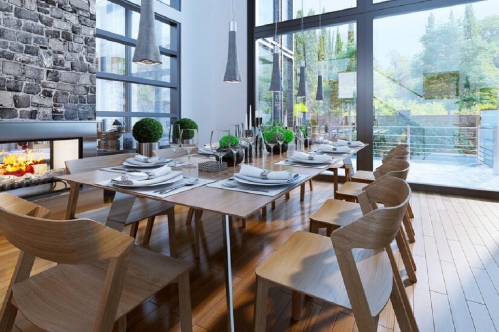 well-decorated-table-with-large-windows-cozy-fireplace-dining-room-furniture-brown_295714-653
